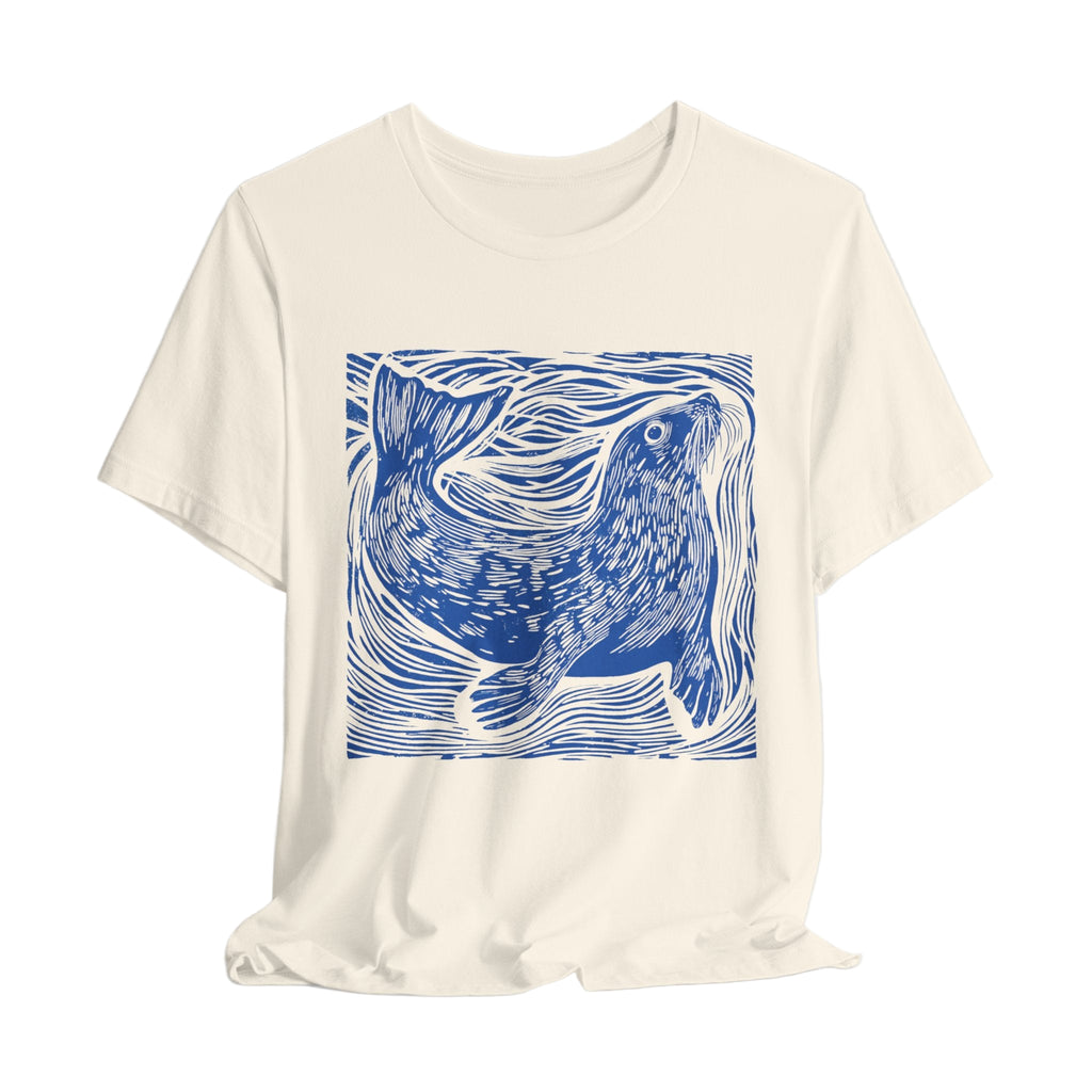 Cream t-shirt with a blue seal design on a white background