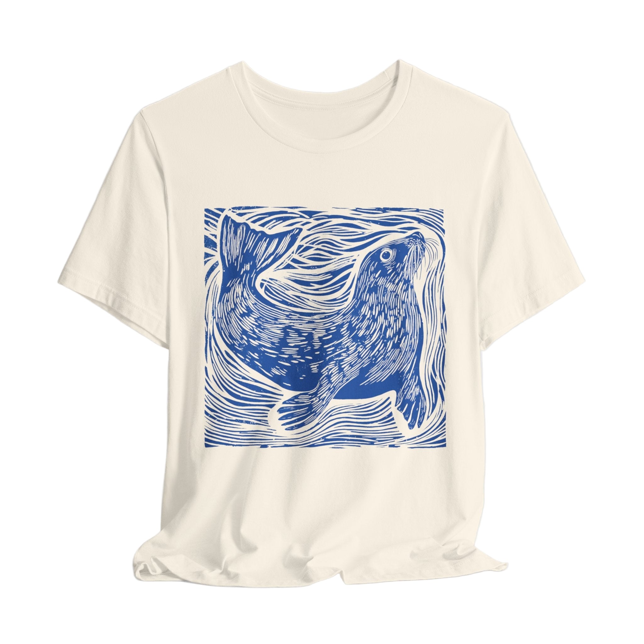 Cream t-shirt with a blue seal design on a white background