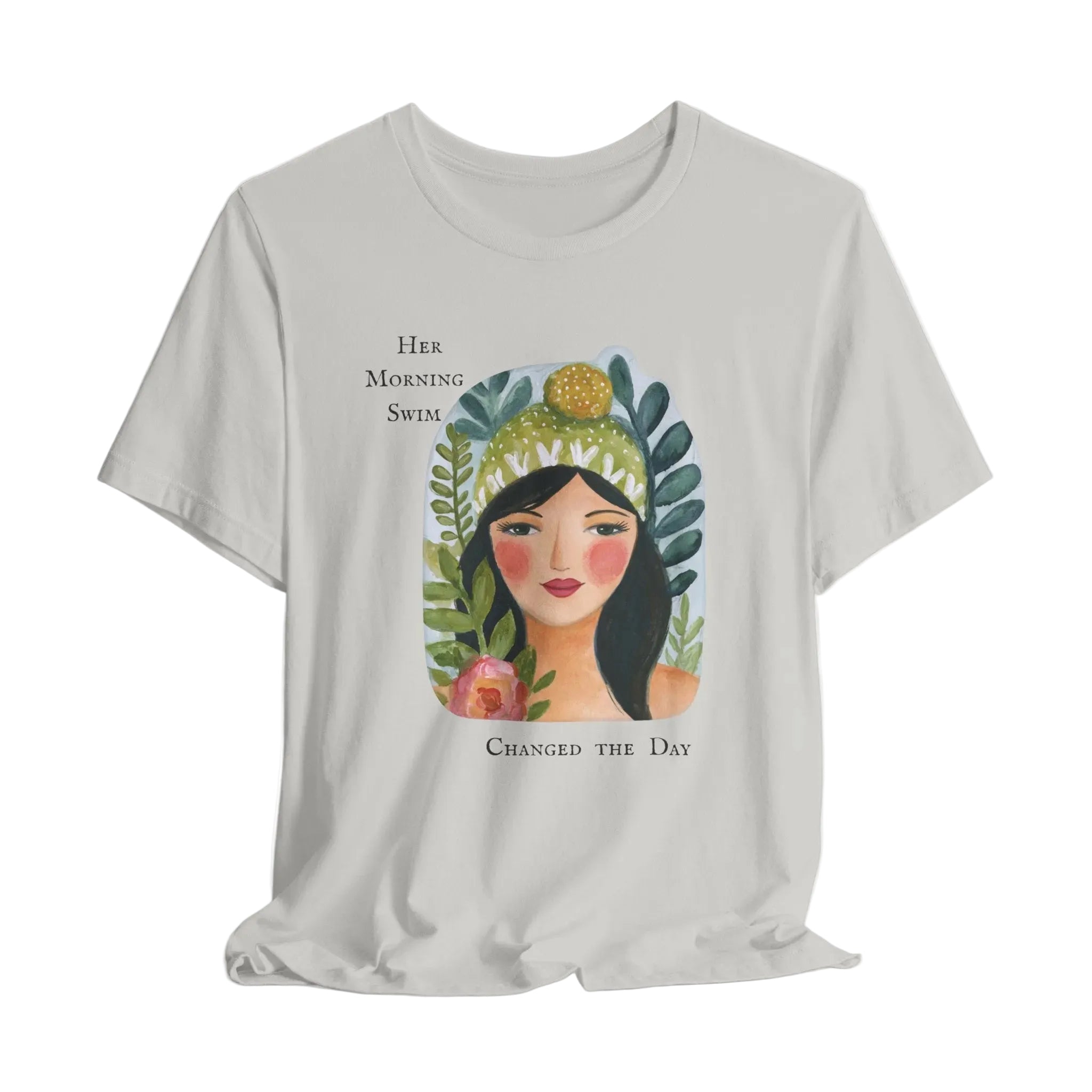 Gray t-shirt with a graphic of a woman's face surrounded by plants and text on a white background